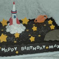 Rocket Ship Rocket ship is fondant as well as the stars and planet. Moon and smoke is buttercream.