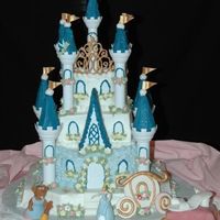 Cinderella's Castle I made this for my 4 year old daughter. Didn't come out as nice as I wanted it tobut she was pleased. Coach is fondant. Pillow is...
