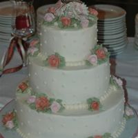 Round Wedding Cake Cake was made to match the Lenox butterfly on the top of the cake. Cakeand flowers are all buttercream.