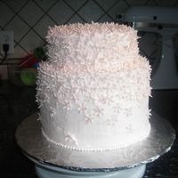 Flowers! Lemon cake with raspberry filling. Iced with buttercream, accented with lots of gumpaste flowers