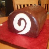 Ho-Ho Chocolate cake with buttercream filling. Dark chocolate ganache on the outside. This was made for a 40th birthday party for a guy who they...