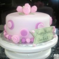 Tea Party Cake This is a chocolate cake with chocolate mousse filling. Covered in fondant with all fondant accents.