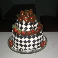 Black & White Affair Birthday cake for a mans 36th birthday. 2 tier bottom double chocolate mocha and top tier butter.