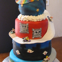 Mario Kart Mario Kart cake I made for my friends 'no more chemo' party. All covered in mmf, airbrushed and hand painted.