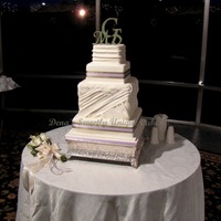 Gathered Fabric Fondant Fondant gathered in drapes on a square fondant covered cake. The taller tier was tricky...I should have just iced them as two and then put...