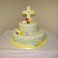 Green Tiered Easter Cake Green fondant covered cake with fondant cross. Cut outs in lighter color green fondant. Gumpaste flowers. I hate the burgandy rose on the...