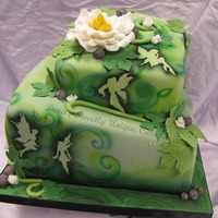Green Shadow Faries Two tier tilted cake with shadowed fairies, airbrushing, fondant, gumpaste leaves and dew drops of hologram mixed in piping gel. Very...