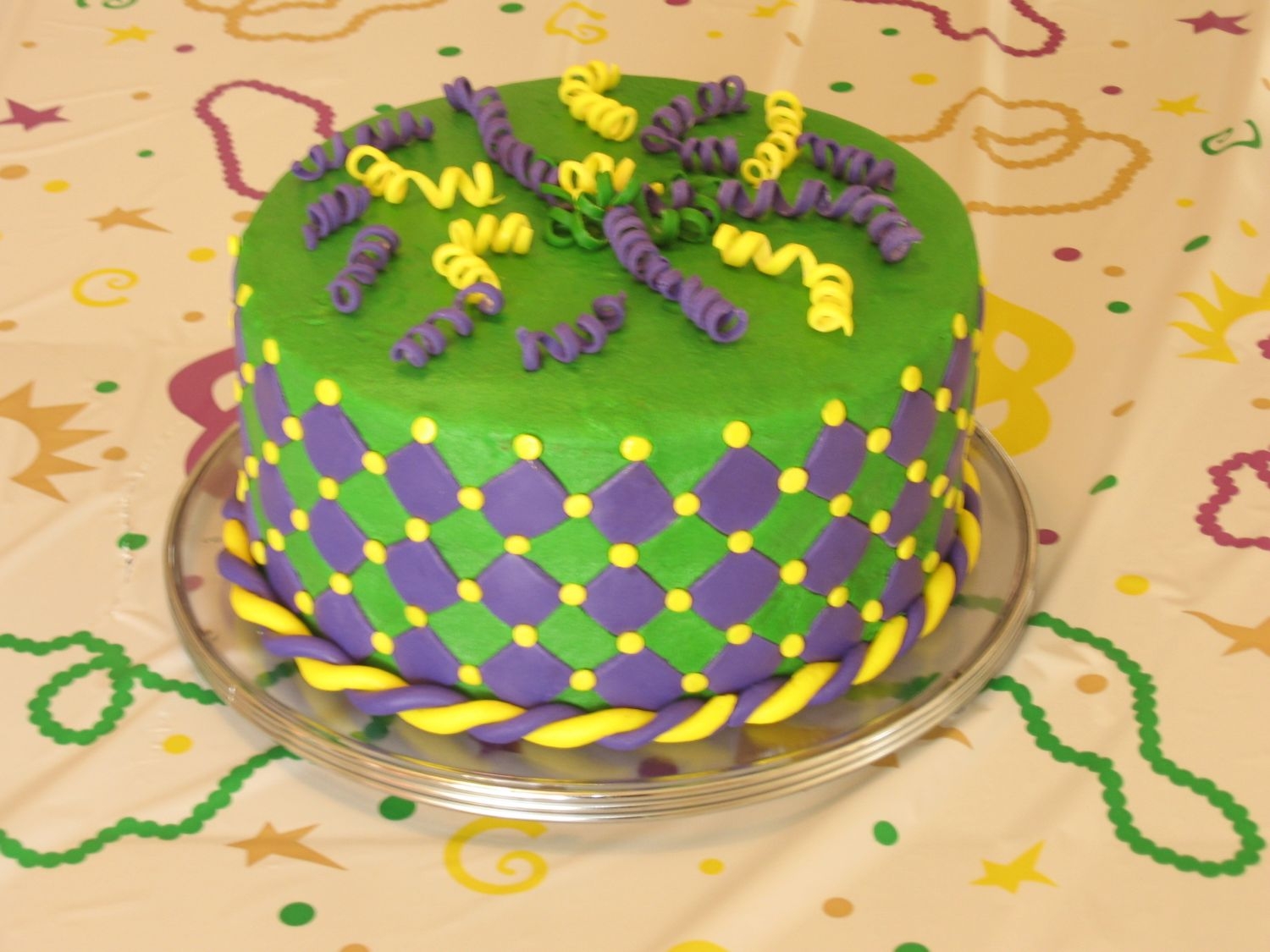 Mardi Gras Theme Birthday Practice cake for daughters birthday. She came up with the design. Hopefully the actual party cake will look better!