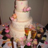 First Wedding Cake My first wedding cake. Pheewww....it's an 16-12-8-6 in cake, all covered in ivory fondant. Still needs a lot of improvement, but...