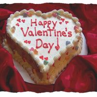 Red Velvet Red velvet cake with crusting cream cheese icing and candy hearts. TFL