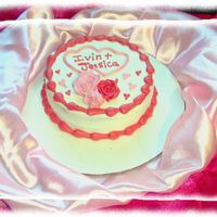 Mini Mini (6in) white cake with raspberry filling and cream cheese icing. I too the pic before I added some candy hearts to it......looked much...