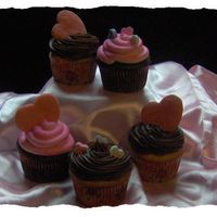 Valentine's Cupcakes Chocolate cupcakes with pink almond buttercream and yellow cupcakes with chocolate fudge icing. Pink sugar cookie hearts and candy hearts...