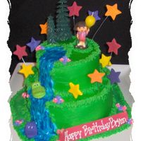 Dora Birthday Cake 2 tier Dora birthday cake. Bottome tier - yellow w/ bc filling. Top tier - chocolate w/ bc filling. Stars made out of fondant and brushed...