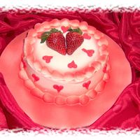 Valentine's For Two Mini (6in) chocolate cake with strawberry filling and fresh sliced strawberries. Iced in cream cheese icing. YUMMY! TFL!!