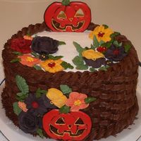 Wilton Course Ii Final Cake - Halloween Theme Chocolate buttercream basketweave, pumpkin colorflow left open where the pumpkins would be carved, royal flowers, and a combination of...