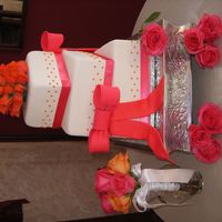 Sunset Cake The colors are based off of a sunset. Roses on top were to match more with the pink but turned out more orange. Fondant with Fondant ribbon...