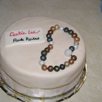 Paula' Party MADE FOR MY SISTER'S JEWELRY PARTY. CHOCOLATE CAKE ICED IN BUTTERCREAM, THEN COVERED W/ MMF. NECKLACE IS MADE FROM MMF ALSO W/ A...