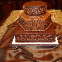 Chocolate Wedding Cake My first wedding cake! This thing took a few years off my life. Top tier was Chocolate Coconut Rum Cake, filled and crumbcoated with...