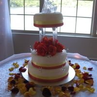 Round Wedding Cake Fondant covered cake, ribbon and crystal butterflies. The top tier had quite the lean to it unfortunately.. I levelled the cakes but didn&#...