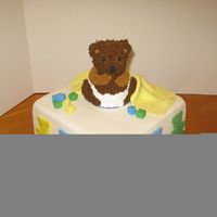 Bear In Diaper This was a fun cake! The bear took way longer than I thought though lol. Three layer (banana, strawberry, chocolate) 10" square.