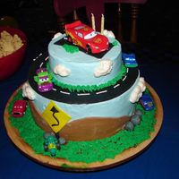 Grandson's 2Nd Birthday Lightning McQueen cake for my grandson who adores lightning McQueen. Cake is vanilla filled with chocolate ganache. Buttercream and fondan...