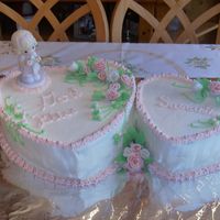 Samantha's !st Comm. THis is a pineapple cake with pineapple filling, buttercream frosting and gumpaste roses.