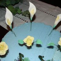Flowers I was asked by a friend to make these flowers for a wedding cake. Just simple cala lillies and roses. Had lot's of fun.