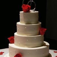 Red Roses Wedding Cake 6", 8", 10" and 14" Italian Creme cake layers iced and filled with cream cheese buttercream. Satin ribbon and real...