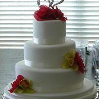 Hearts And Fondant 5", 8" and 11" almond cake layers iced and filled with buttercream then covered with Pettinice white fondant. Satin antique...