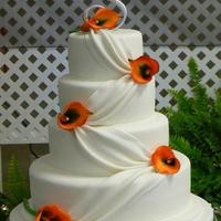 Drapes And Callas 6", 8", 10" and 14" cake layers iced with buttercream then covered with white Pettinice fondant. Fondant drapes - a...