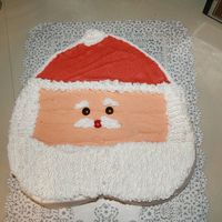 Santa Cake I made this cake for my aunt's office party. It is a chocolate cake with buttercream icing.