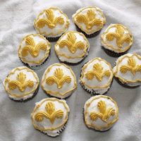 Fleur De Lis Cupcakes I made these cupcakes with a few cupcakes I had leftover from another project. I used a tip 21 to make the Fleur de Lis. Thanks for looking...
