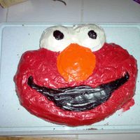 Elmo For my youngest son's first birthday, the theme was baby Sesame St. I made an Elmo cake & a Cookie Monster cake using the Wilton...