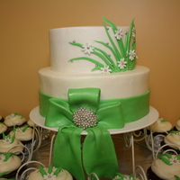 Bridal Shower Cake Butter cream with fondant acents and matching cupcakes :-)