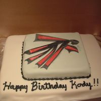 Atlanta Falcons I call this contemporary Atlanta Falcon art. I used fondant for make the image, it's very flat image. The cake is completely covered...