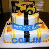 Construction Birthday Cake This cake was made for my grandson's 2nd birthday. The cones and letters are made of fondant and the rest is buttercream.