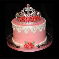 Princess Tiara Cake This is a carrot cake iced with crusting cream cheese frosting and decorated with fondant pearls, lace and ribbon roses.