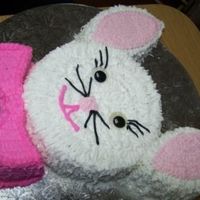 Easter Bunny Cake It was made of 2 rounds cake and cut out by hand it was all decorated in buttercream icing. I think it could be better but it was my first...