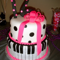 16 Piano Cake! I made this cake for my best friend's 16th surprise birthday party. everything is made out of fondant. For the bow i put cotton balls...
