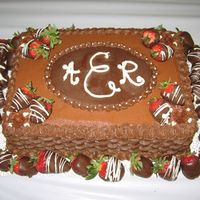 Chocolate Buttercream Groom's Cake I did this cake with a cream cheese filling. The oval on top of the cake was made from melted chocolate I had leftover from the...