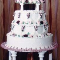 My Wedding Cake 1990 All BC with BC roses, fountain and silk flowers. Made by my aunt, which made my wedding day very special. Sorry for the poor quality of the...