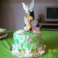 Tinkerbell Cake My daughters 5th birthday cake. Buttercream frosting and fondant flowers. The topper was a toy.