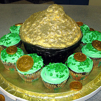 Pot O' Gold Cake With Field Of Shamrock Cupcakes A pot o' gold (made from the Wilton Giant Cupcake pan) surrounded by a field of mint chocolate cupcakes. I used edible glitter to make...