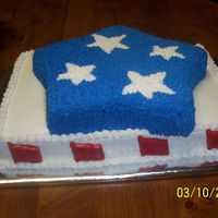 Fourth Of July This cake was made to welcome home a friend from Iraq. It was a half sheet cake with a star cake on top. The flags around the sides were...