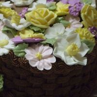 Wilton Course 2 Finale Detail Close-up of the different flowers: primrose, pansy, daisy, daffodil, victorian rose, chrysanthemum, violet, and apple blossoms.