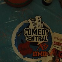 Everything He Loves foundant covered white almond cake with Gum paste hand painted symbels