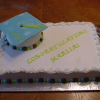 Graduation Cake Made for my co worker's daughter's grad party. Green and brown were here favorite colors. White chocolate cap, w/BC icing.