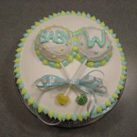 Baby Rattle Shower Cake Baby Rattle Theme for a shower with baby rattle cupcakes.