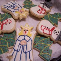 Christmas Cookies NFSC with MMF icing and accented with candy melts. Very easy and they can be packaged as soon as they are cool. No waiting for them to dry...