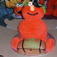 Pirate Elmo This was fun to make. The head, arms and legs are rice krispy treats. I used the wondermold pan on an 8`` round. The treasure chest was the...